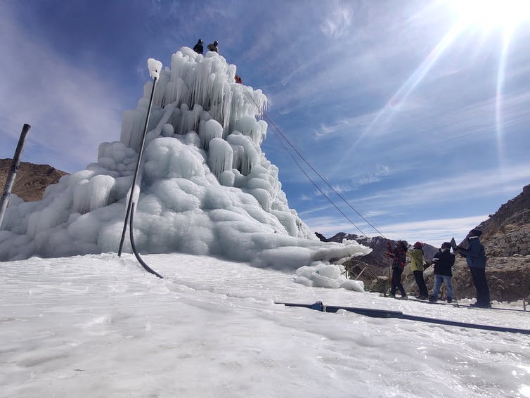 An ice stupa - an artificially created mini glacier - in the mountains of the Lahakh region.