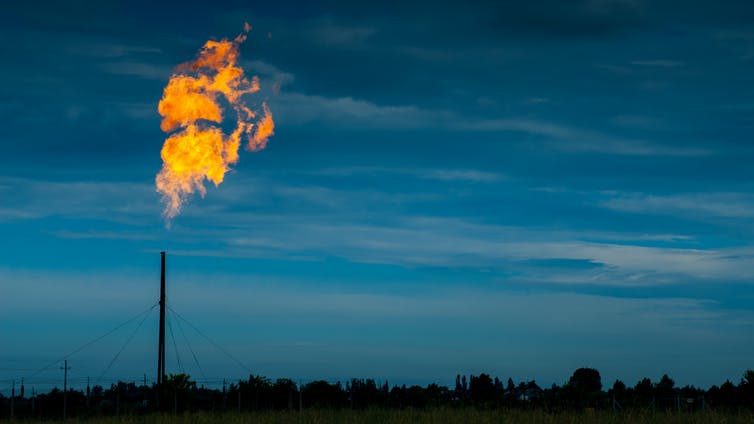 A flame rising above a  gas distribution site.