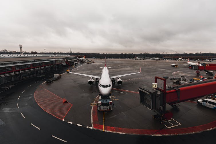 An aeroplane parked at an airport