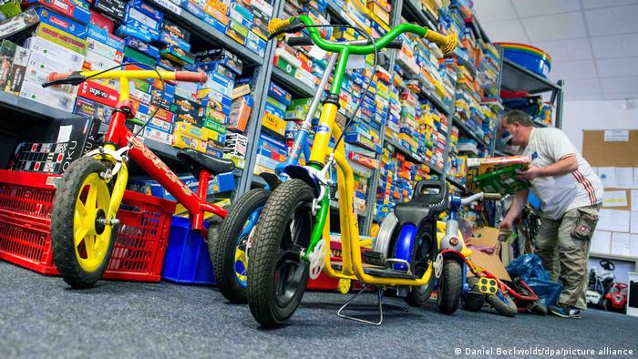 Shelves of games, with bikes in the foreground