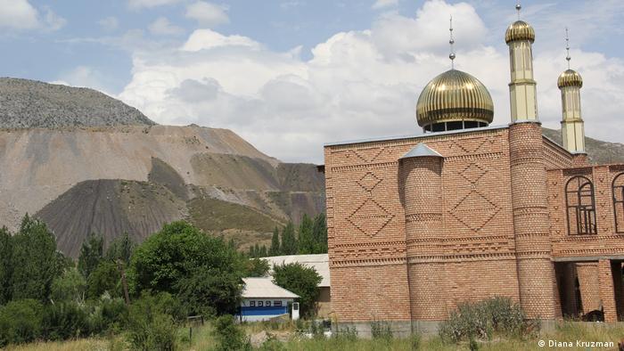 Building in Aidarken, Kyrgyzstan with mine in the background 