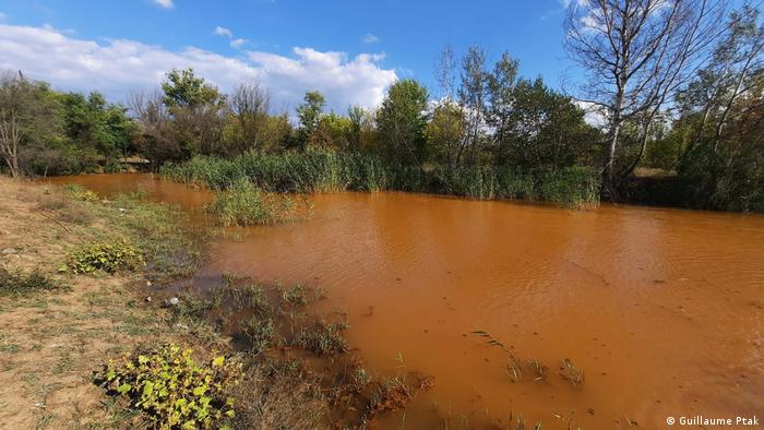 The Komyshuvakha river, colored orange by highly mineralized mine water