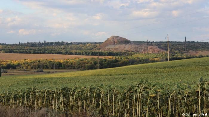 Mine tailings visible from a distance, near the city of Zolote.