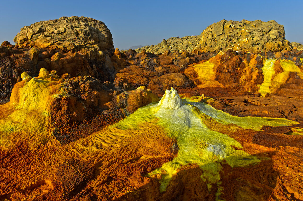 Salt mounds grow where hypersaline water emerges from the geothermal field.