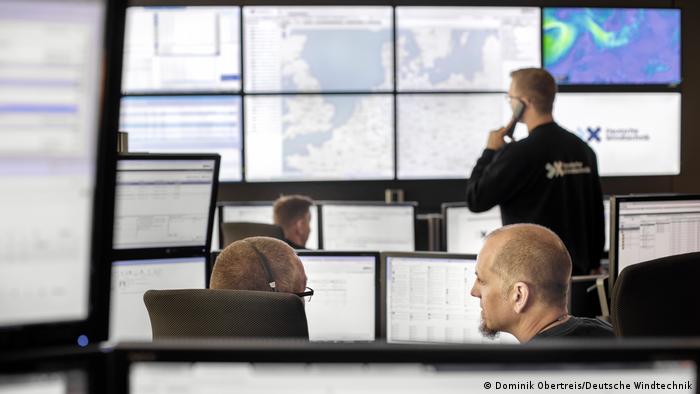 Andr Klatt (front right) and his colleagues sit in a control room in front of computers