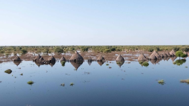 An aerial view shows houses submerged in flood waters in Bentiu, in Unity State, South Sudan in December 2021