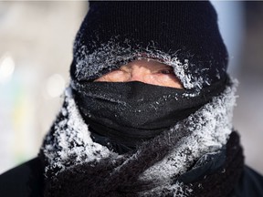 Frost built up on the toque and scarf of a downtown commuter in Saskatoon during a freezing cold yet beautiful winter day. Photo taken in Saskatoon on Monday, December 27, 2021.