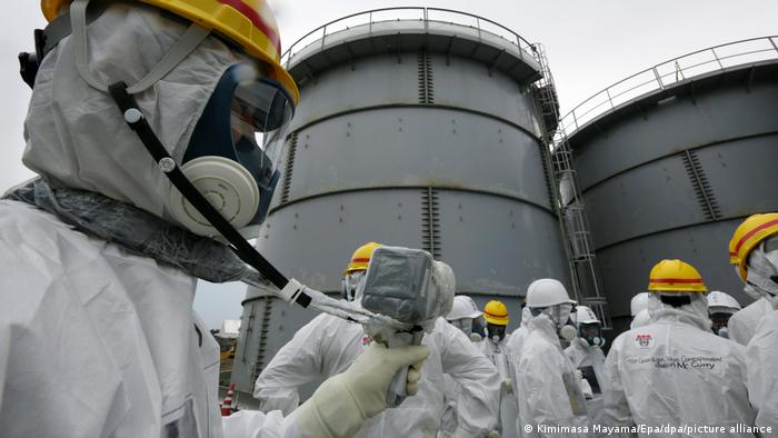 Officials at Fukushima measuring radiation