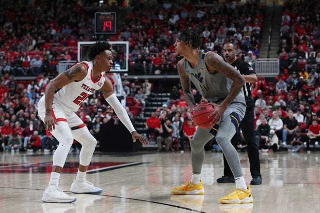 West Virginia's Jalen Bridges (11) looks to drive the ball against Texas Tech's Adonis Arms (25) during the second half of a Big 12 Conference game Saturday at United Supermarkets Arena. Arms finished with 14 points and nine rebounds in the win.