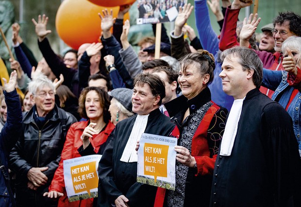 Urgendas campaigners outside the Dutch Supreme Court ahead of their landmark victory in 2019  Getty Images
