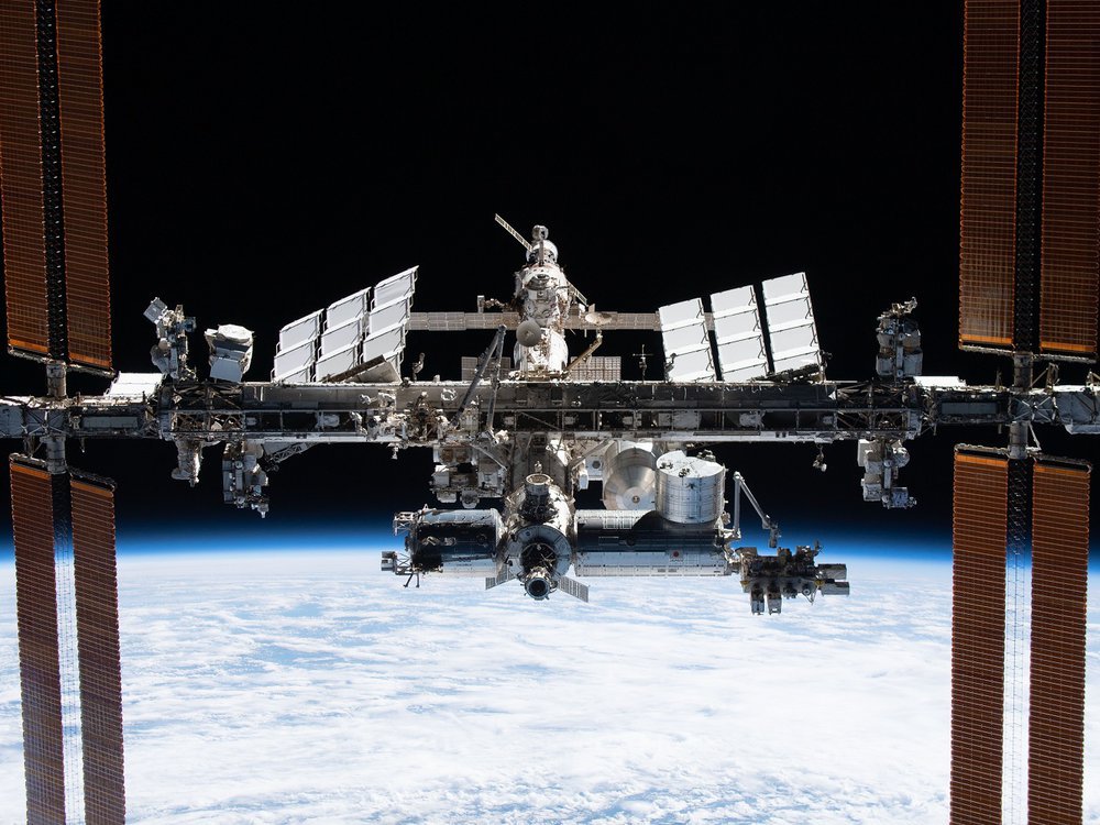 picture of large metal space station in orbit