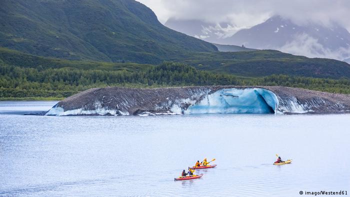 Kayakers on Valdez Glacier Lake in Alaska