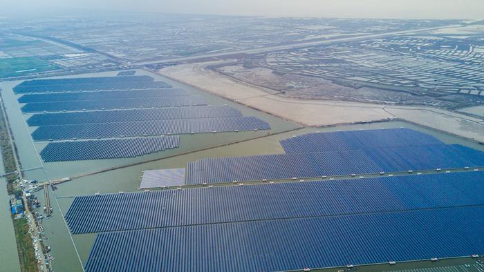 Solar power station in Cixi, China on a lake with a fish farm underneath