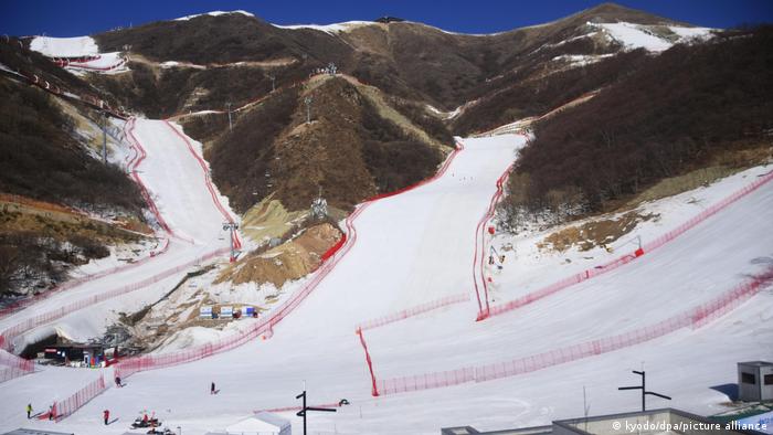 Bare mountainsides contrast with snow runs 