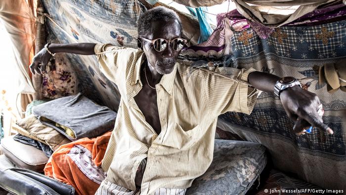 Pape Ndiaye (66), an old waste picker and spokesman for the waste pickers association, rests in his makeshift office.