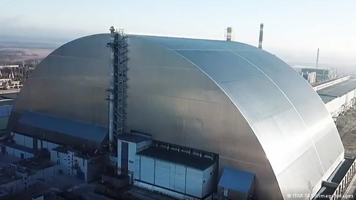 A massive steel and concrete structure contains nuclear reactor number four at the Chernobyl power plant 