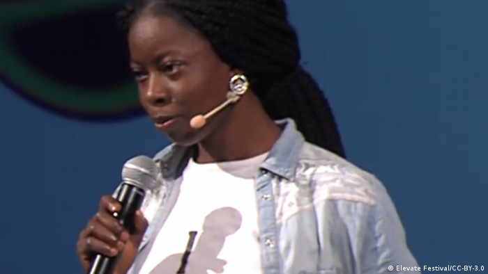 Adenike Oladosu talking on a stage