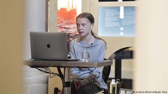Greta Thunberg sits on her laptop in the Stockholm Nobel Museum on Earth Day 2020