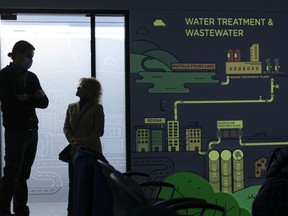 An interactive display (right) is projected onto the wall of the Education Room at the citys Waste Management Centre.