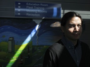 Bruno Hernani poses in front of his art installation outside the Education Room at the citys Waste Management Centre. The piece, made with recycled materials, will inspire individuals to think about how the choices they make impact the environment.