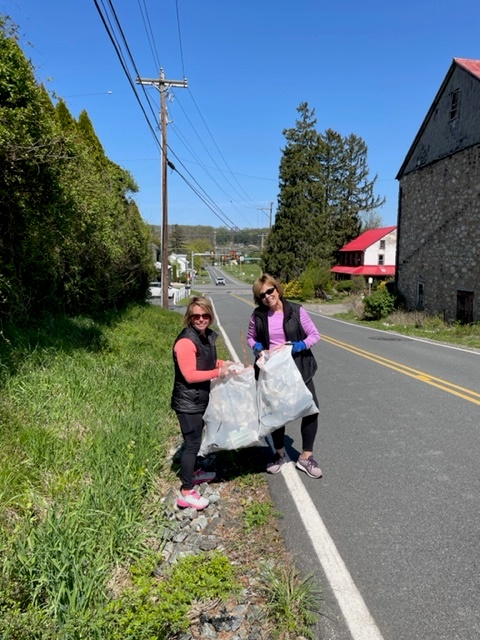 Boyertown Rotarian Wendy Barton and volunteer Joan Spence collect trash along Gehringer Road for the Boyertown Rotary Club Day of Service. (Submitted photo)