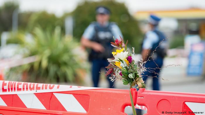 Flowers in front of a police blockade