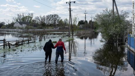 To keep Russian armored columns at bay, Ukrainian forces burst a dam near Demydiv, a village north of Kyiv.